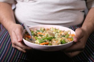 Scientists reviewing dietary guidelines documents showing evidence standards controversy