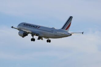Air France aircraft on tarmac with health screening protocols in background