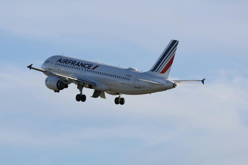 Air France aircraft on tarmac with health screening protocols in background
