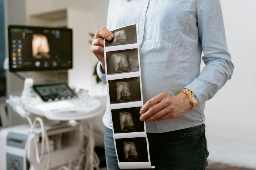 Healthcare provider conducting antenatal care consultation with pregnant woman