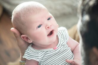 Parent speaking to baby using parentese communication style