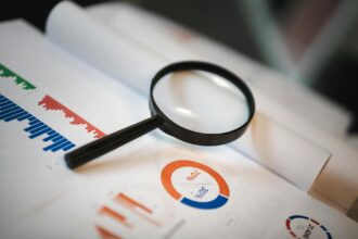 Medical researchers reviewing data charts showing registration requirements across different study types