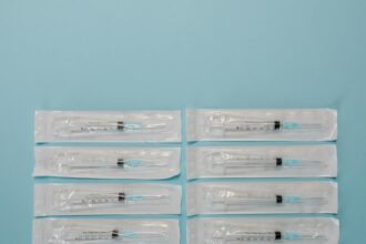 Automated compounding system with syringe labels in hospital pharmacy setting