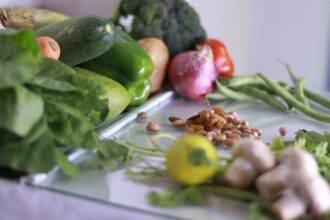 Comparison chart showing vitamin content in fresh versus frozen vegetables and fruits