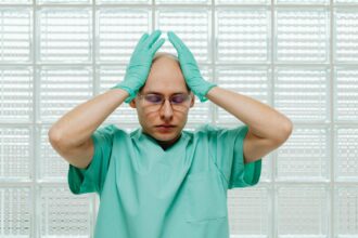 Healthcare professionals discussing patient care in hospital setting showing human connection