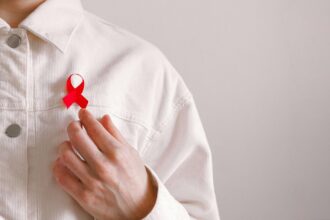 Healthcare workers discussing HIV stigma reduction strategies in clinical setting