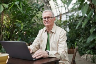 Older adult using tablet computer for health intervention program