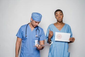 Medical consultation showing gynecological examination room with healthcare equipment