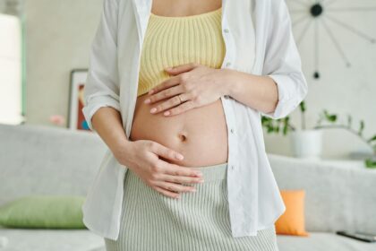 Pregnant woman sleeping; medical illustration of gestational diabetes risk factors