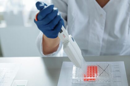 Medical illustration showing stem cell-derived heart patch being placed on damaged cardiac tissue