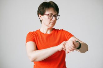 Woman wearing smartwatch for health monitoring representing digital medicine advancement