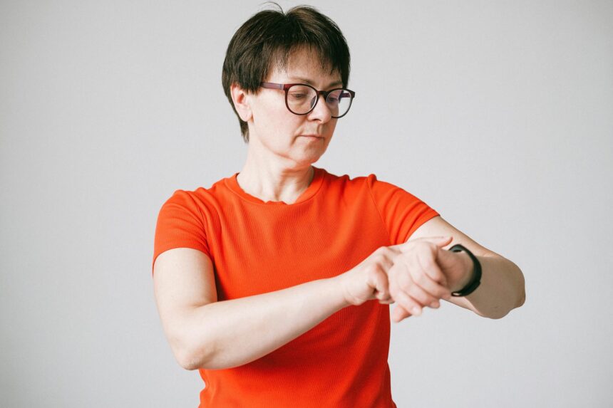 Woman wearing smartwatch for health monitoring representing digital medicine advancement