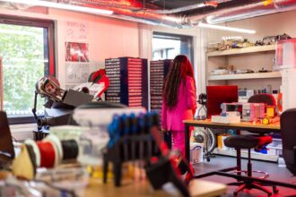 UK Health Security Agency logo and laboratory equipment for communicable disease testing