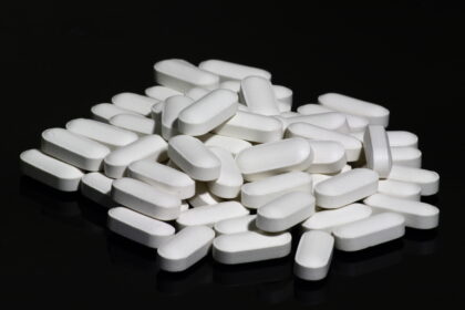 Older adult consulting with healthcare provider about bone health supplementation and fracture prevention strategies
