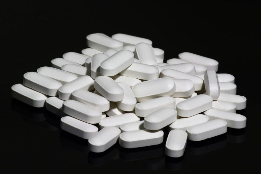 Older adult consulting with healthcare provider about bone health supplementation and fracture prevention strategies