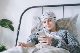 Hospital pharmacy shelves showing chemotherapy drug shortages impacting cancer treatment delivery