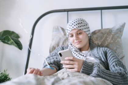 Hospital pharmacy shelves showing chemotherapy drug shortages impacting cancer treatment delivery
