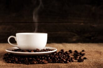 Horizontal bar chart comparing coffee consumption and cancer risk reduction across liver, colorectal, and endometrial cancers