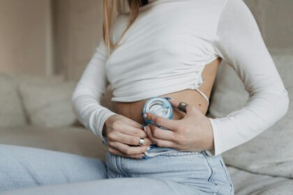 Medical professional examining insulin pump device for safety inspection