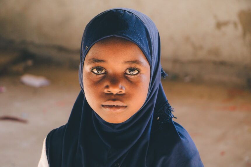 Educational materials and community health workers in Tanzania conducting FGM awareness intervention