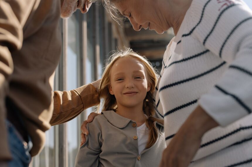 Grandparent and grandchild having meaningful conversation outdoors