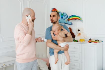 First-time father learning about infant safety in hospital nursery