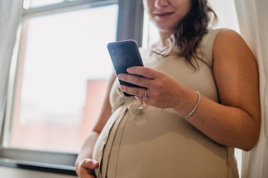 Rural healthcare worker using mobile phone for pregnancy data collection in Bangladesh