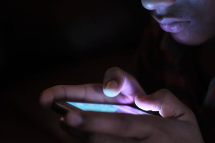 Healthcare worker conducting phone-based mortality survey in rural Bangladesh setting