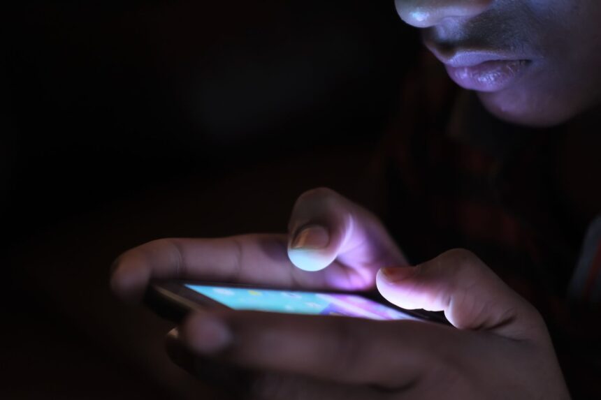 Healthcare worker conducting phone-based mortality survey in rural Bangladesh setting