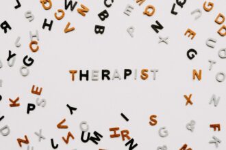 Medical professional discussing psychedelic therapy regulations with patient in clinical setting