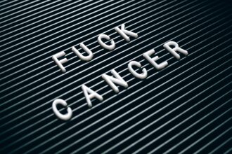 Medical illustration showing focused radiation beams targeting prostate tumor with precision radiotherapy technology