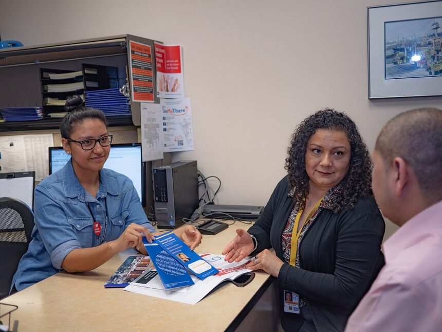 Medical professional reviewing medication dosing guidelines and genetic testing results