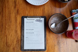 Restaurant menu with warning label highlighting high-sugar items