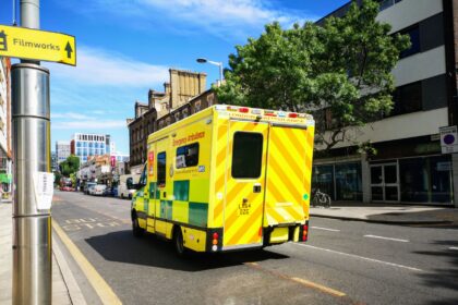 NHS emergency department during busy period with medical staff treating patients
