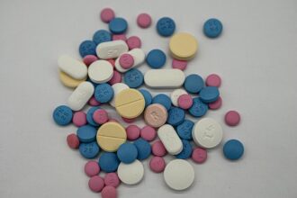 Medical pills and regulatory documents representing UK medicine approvals