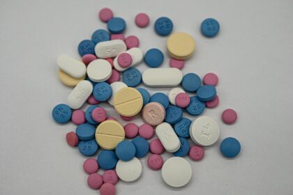 Medical pills and regulatory documents representing UK medicine approvals