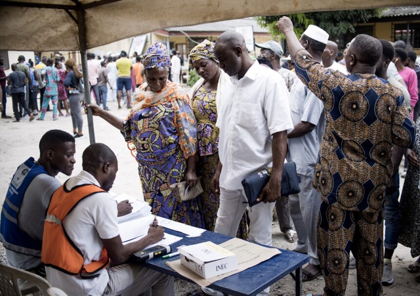 Healthcare workers in Malawi distributing mosquito nets as part of malaria prevention program
