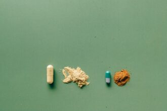 Chart comparing fractional iron absorption: alternate-day dosing (21.8%) vs daily dosing (16.3%), ferrous sulfate 60 mg