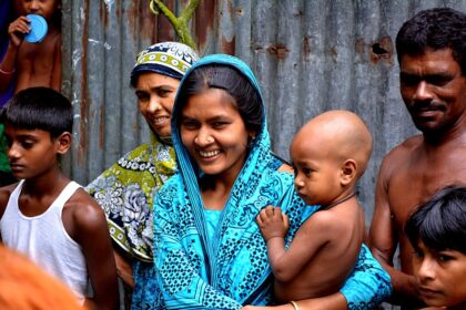 Healthcare workers treating measles patients in a crowded hospital ward in Bangladesh
