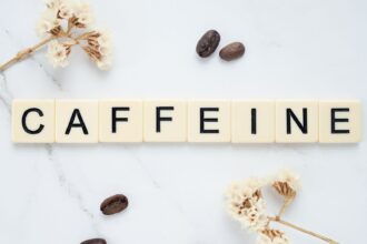 Infographic showing caffeine clearance rates by CYP1A2 metabolizer status: slow (8-10+ hours), intermediate (5-7 hours), fast (2-3 hours)