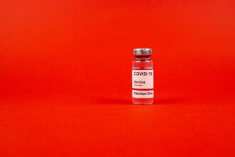 Scientific research documentation showing vaccine effectiveness data and peer review process