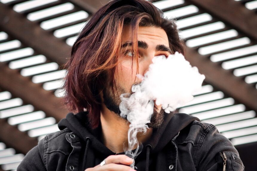 Infographic showing common e-cigarette side effects and MHRA Yellow Card reporting process