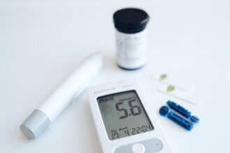 Clinical expert discussing continuous glucose monitoring device and childhood health outcomes