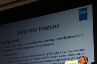 Laboratory researcher examining genetic samples for ultra-rare disease research
