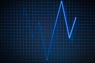 Illustration of cardiac cells synchronizing to produce first heartbeat through collective electrical activity