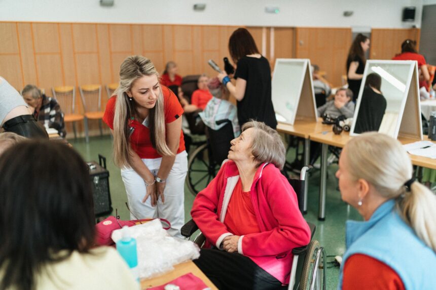 Healthcare worker supporting elderly dementia patient during therapy session