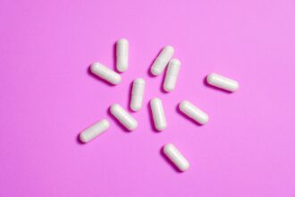 Older adult receiving medical consultation demonstrating therapeutic relationship and open-label placebo treatment context