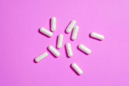 Older adult receiving medical consultation demonstrating therapeutic relationship and open-label placebo treatment context