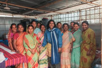 Community health workers and researchers collaborating on health intervention design