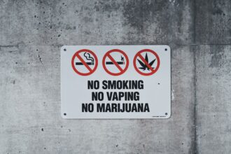Colourful vape packaging stacked in retail display; regulatory consultation announcement graphic